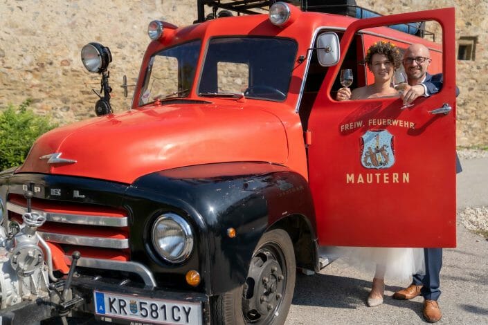 bridal couple with fire truck